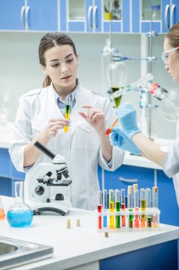 Female scientists in lab clipart