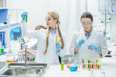 Female scientists in lab clipart