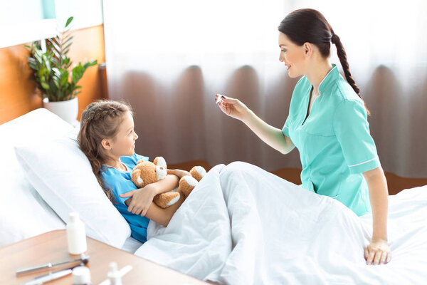 Girl and nurse in hospital