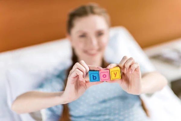 Pregnant woman with word boy — Stock Photo, Image