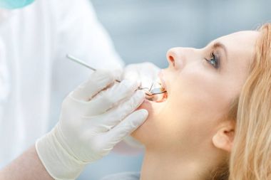 woman at dental check up clipart