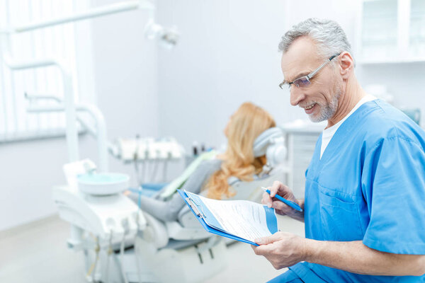 senior dentist in uniform