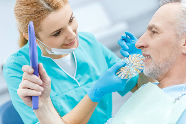 Dentist and patient in clinic 