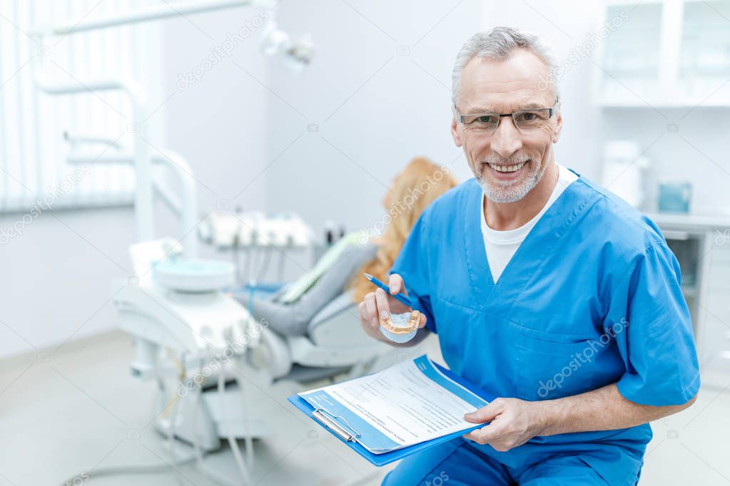 senior dentist in uniform