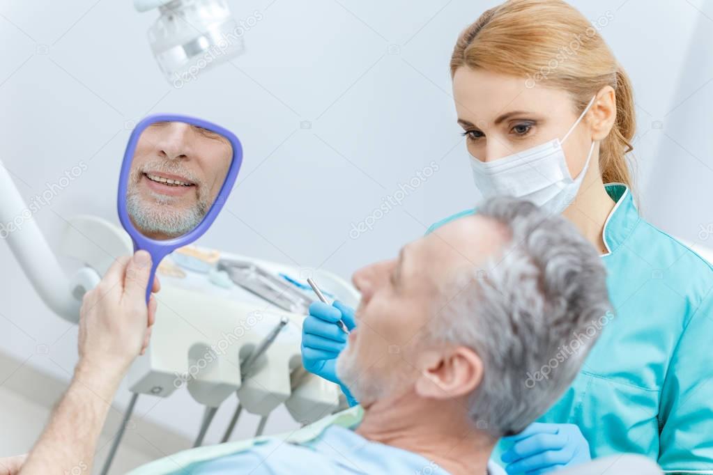 Dentist and patient in clinic 