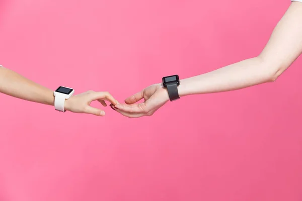 Mother and daughter with smartwatches