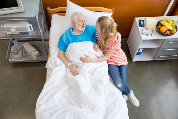 senior patient with granddaughter