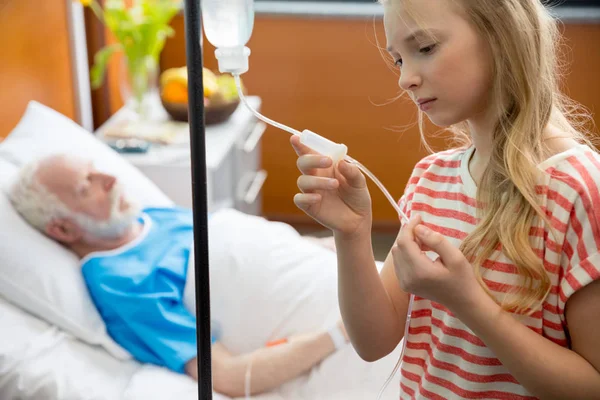 Grandfather and child in hospital — Free Stock Photo