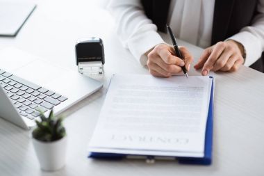 businesswoman signing contract 