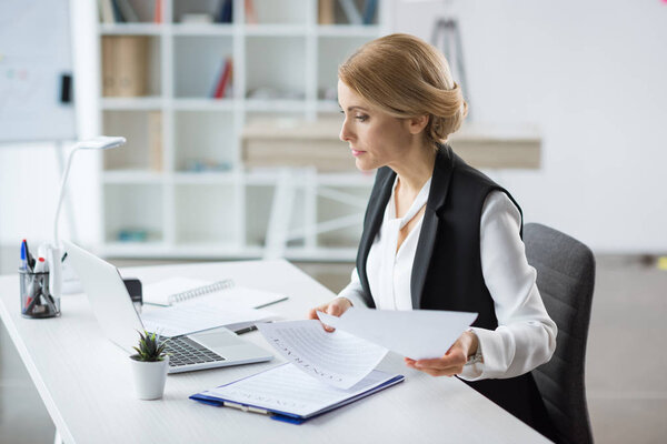 Businesswoman using laptop 