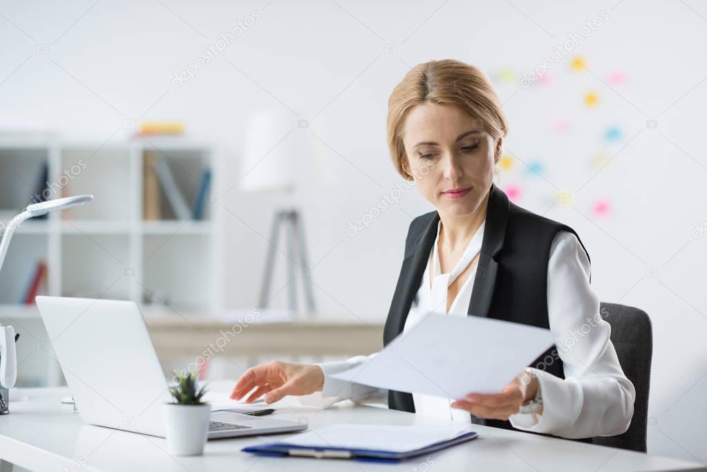 Businesswoman using laptop 