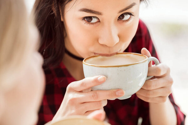 woman drinking coffee