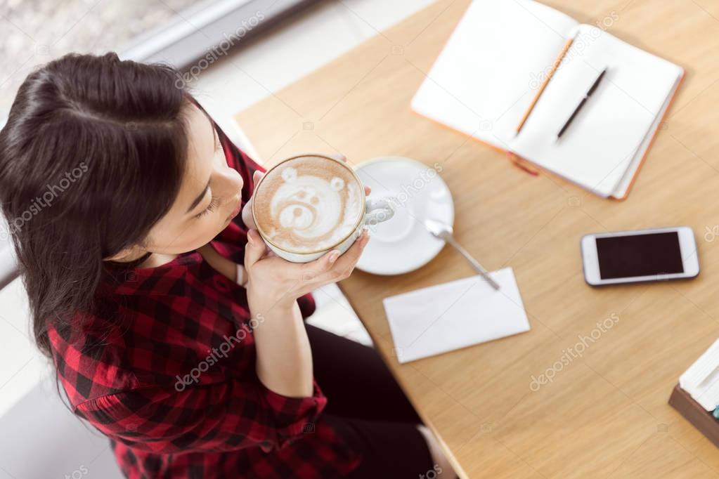 asian girl drinking coffee