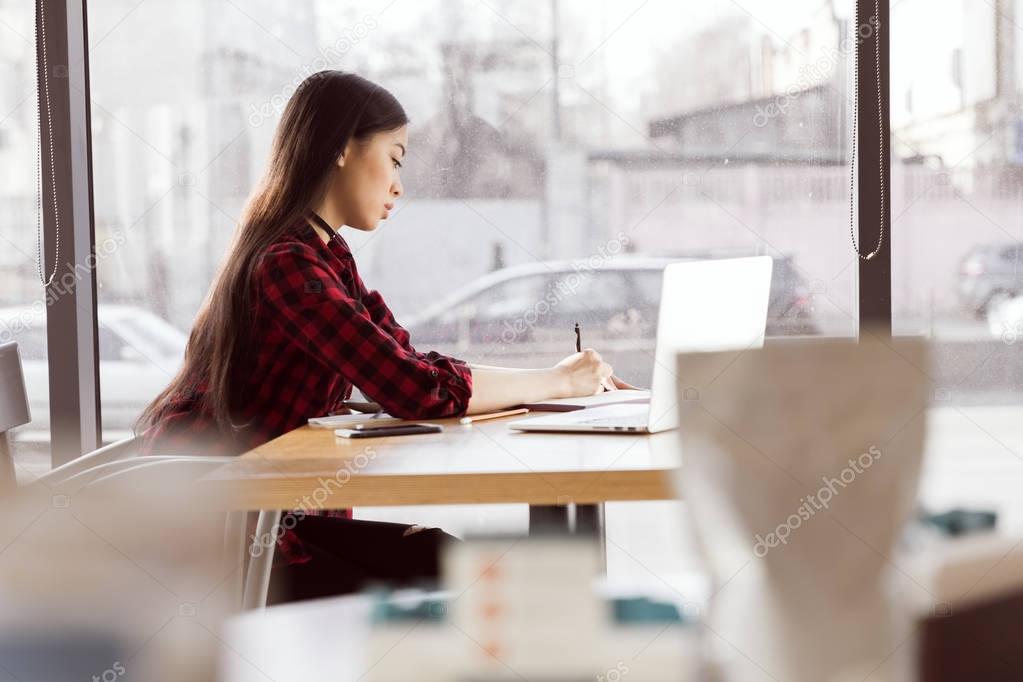 Young woman with laptop 