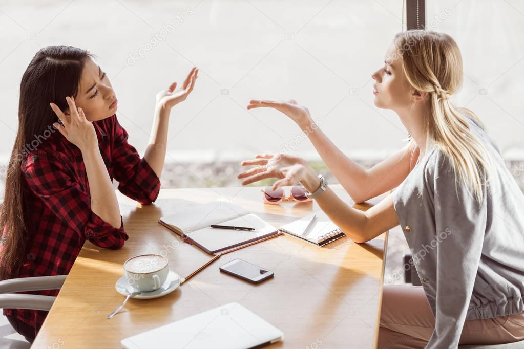 Young women at business lunch 