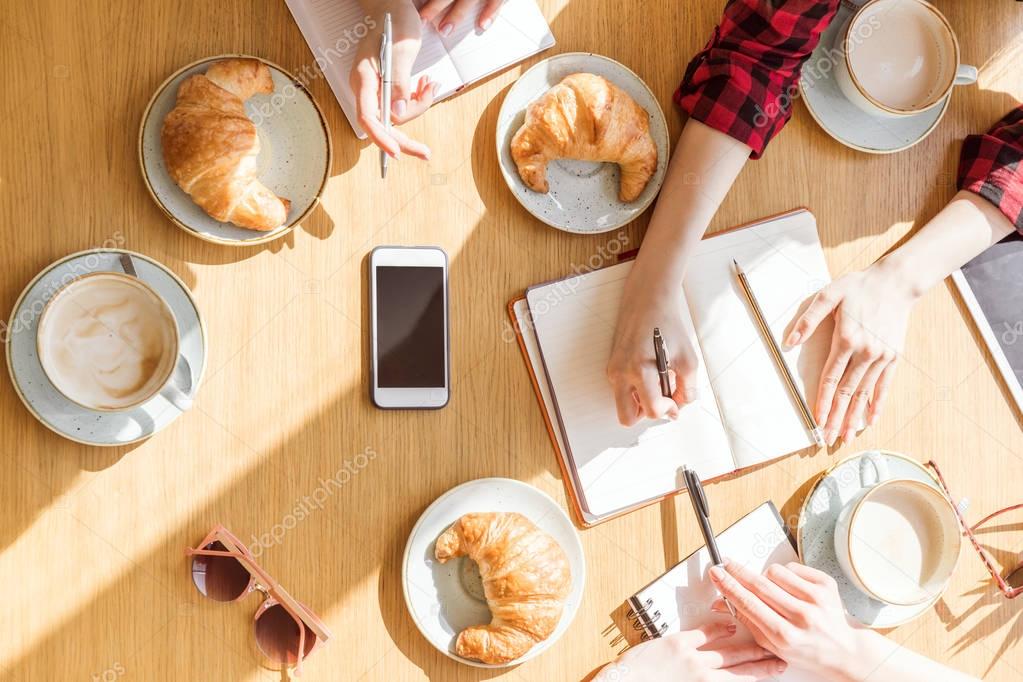 women sitting at coffee break