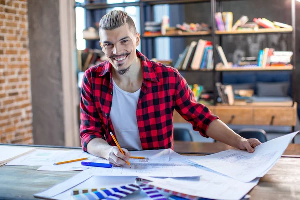 Male architect with blueprints — Stock Photo