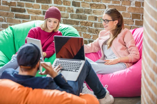 People in bean bag chairs — Stock Photo