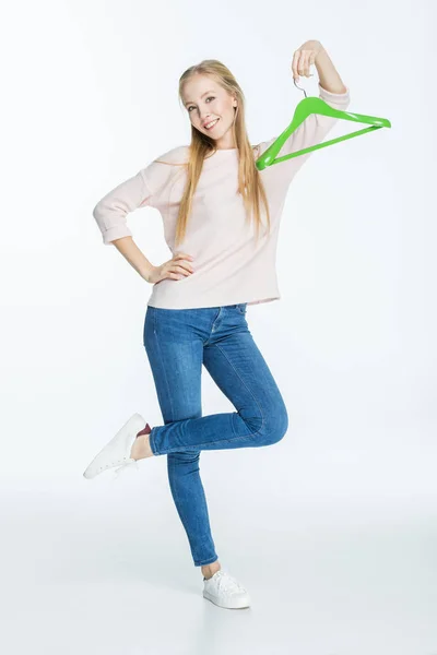 Woman holding hanger — Stock Photo