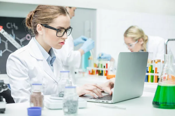 Scientist working on laptop — Stock Photo