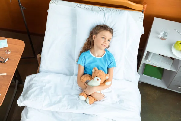 Patient with teddy bear — Stock Photo