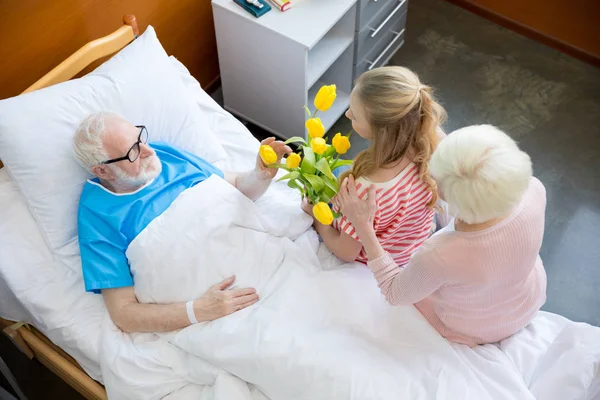 Grandmother and granddaughter visiting patient — Stock Photo