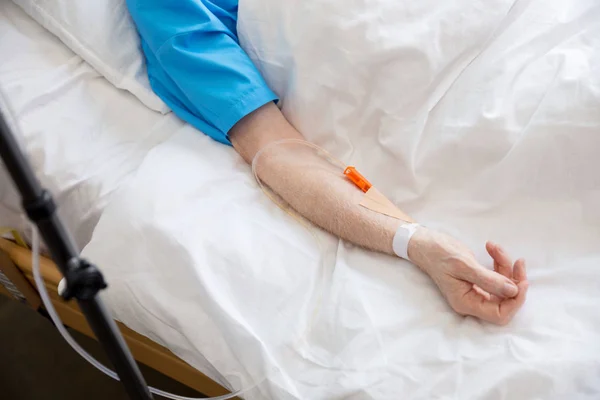 Senior man in hospital bed — Stock Photo