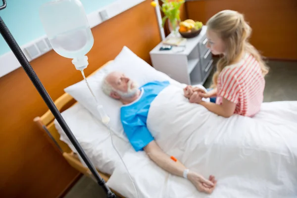 Grandfather and child in hospital — Stock Photo