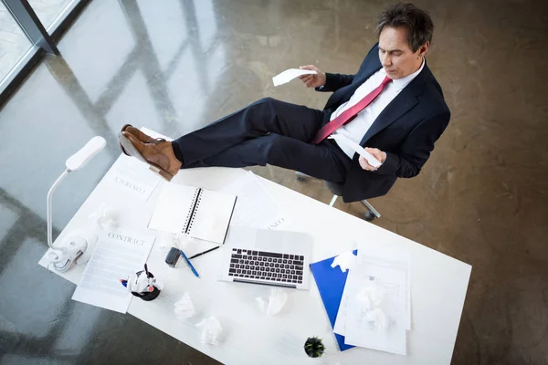 Mature businessman at workplace — Stock Photo