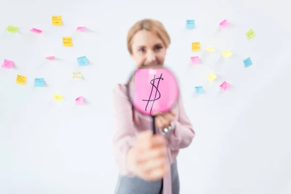 Businesswoman with magnifying glass — Stock Photo
