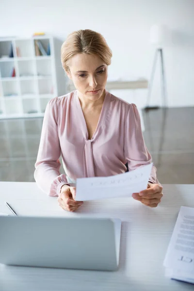 Serious businesswoman working with documents — Stock Photo