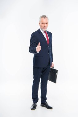 İşadamı baş parmağını gösteriyor 