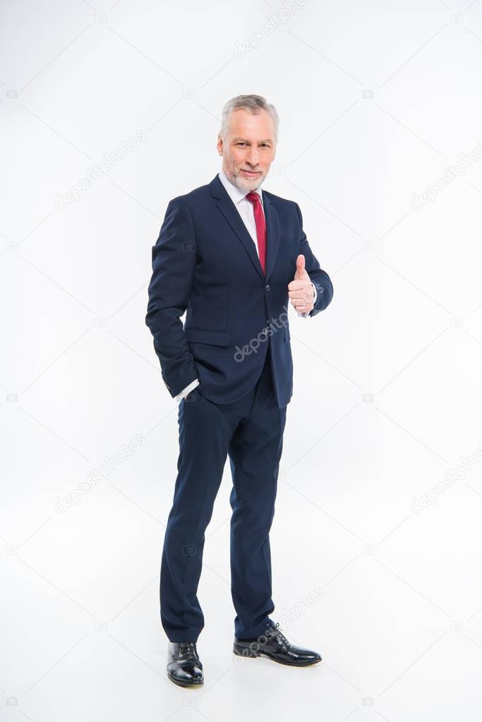 Businessman showing thumb up 