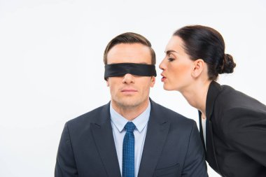 Businessman in blindfold and businesswoman clipart
