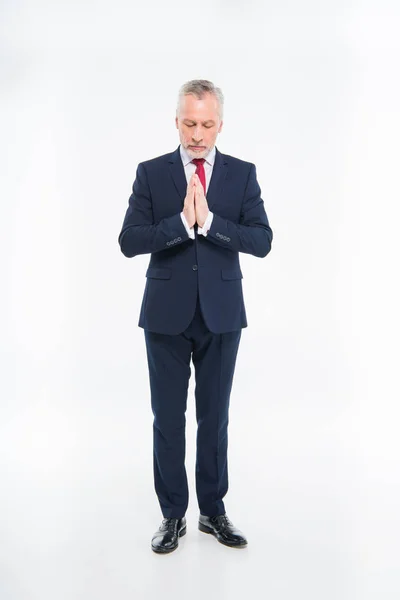 Mature businessman praying — Stock Photo, Image