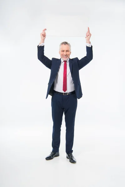 Businessman holding blank card — Stock Photo, Image