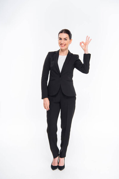 Businesswoman showing OK sign 