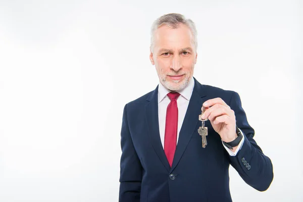 Businessman holding keys — Stock Photo, Image