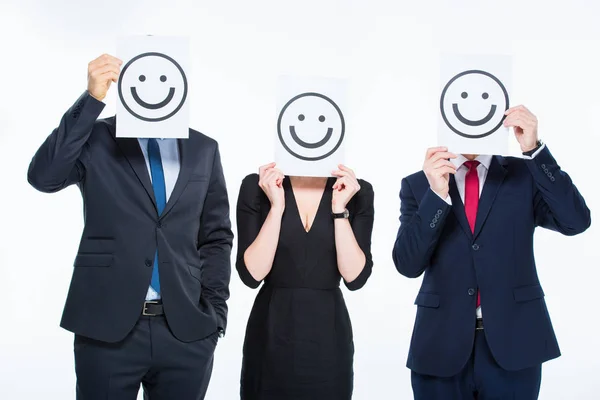 Businesspeople holding cards — Stock Photo, Image