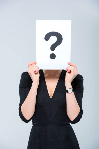 Woman holding card with question mark 