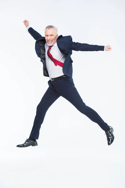 Mature businessman jumping — Stock Photo, Image