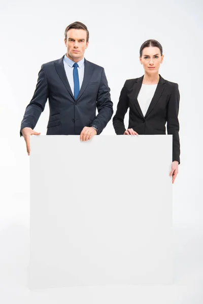 Businesspeople holding blank card — Stock Photo, Image