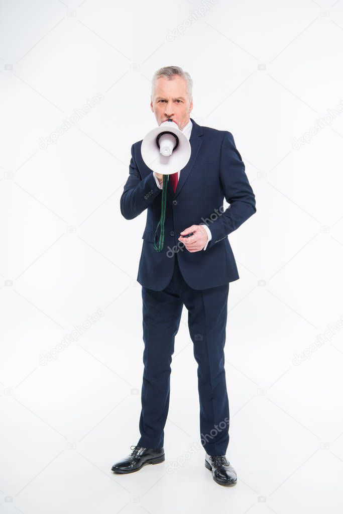 Businessman shouting in loudspeaker 
