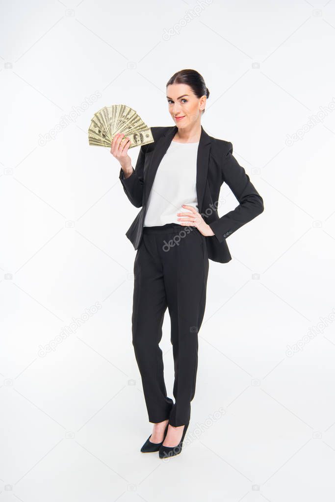 Businesswoman holding dollar banknotes