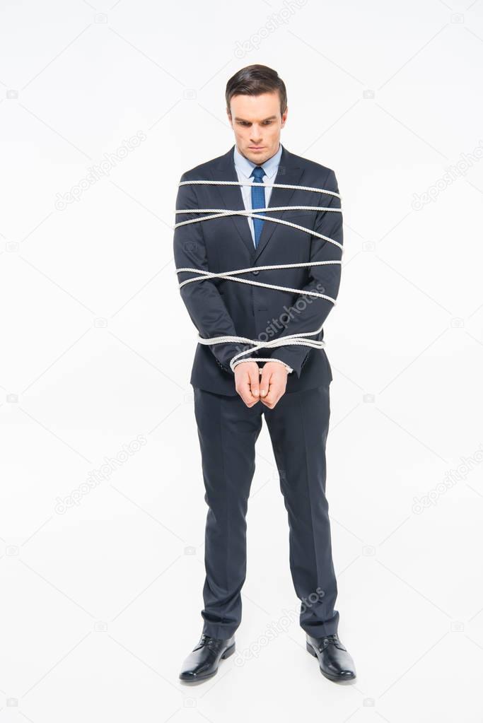 Young roped businessman