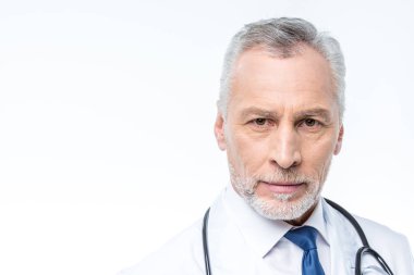 Mature doctor with stethoscope  clipart