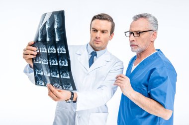 Doctors examining x-ray image clipart