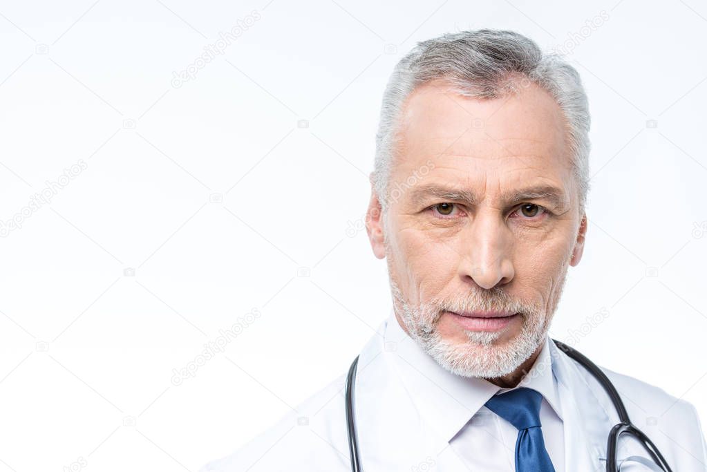 Mature doctor with stethoscope 