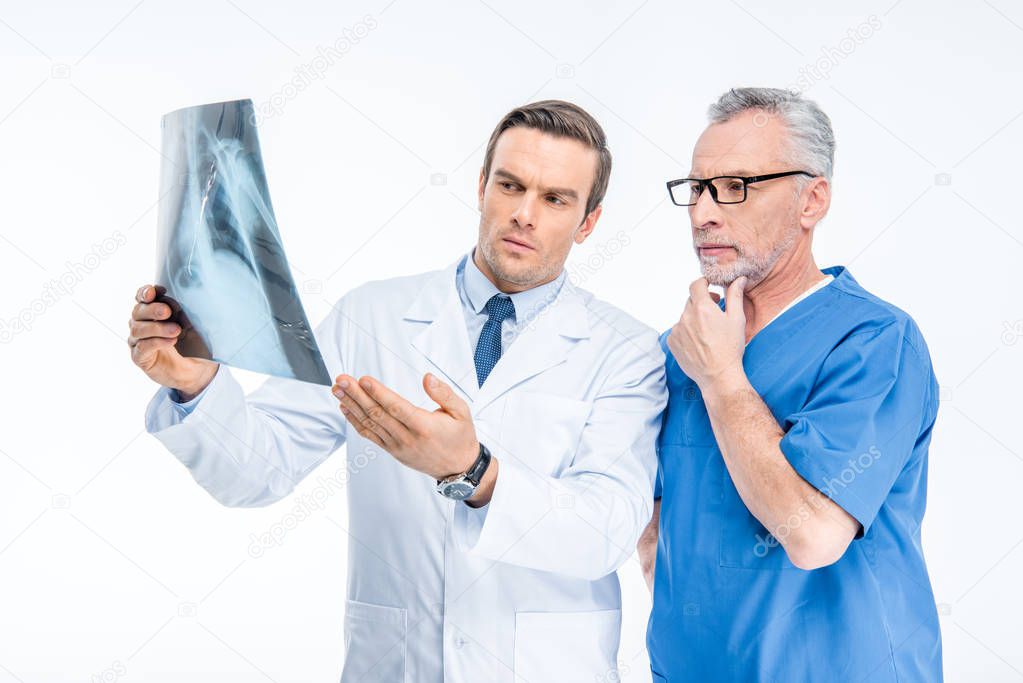 Doctors examining x-ray image