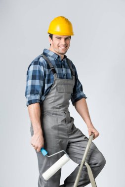 Workman with paint roller  clipart